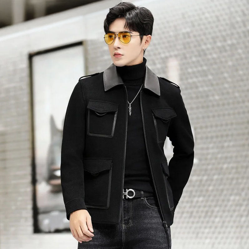 Onyx men’s leather-accented mini-coat, model looking to the side, emphasizing refined structure and modern leather detailing. From Borcelleclothes.