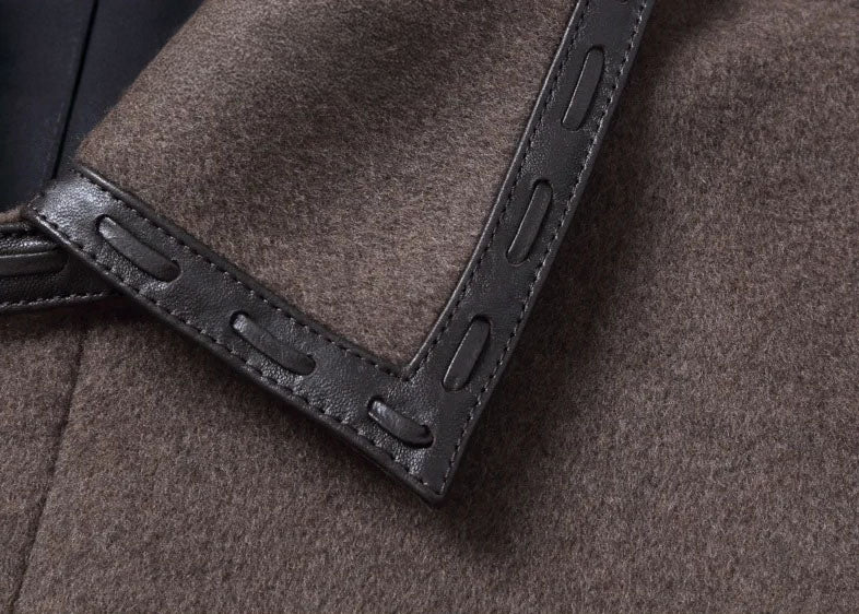 Men’s leather cord weaving wool coat in Falcon, close-up of the left corner of the collar with leather cord weaving detail. From Borcelleclothes.