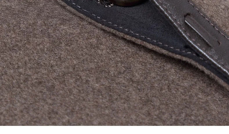 Men’s leather cord weaving wool coat in Falcon, close-up of unfolded and fastened part of the placket. From Borcelleclothes.