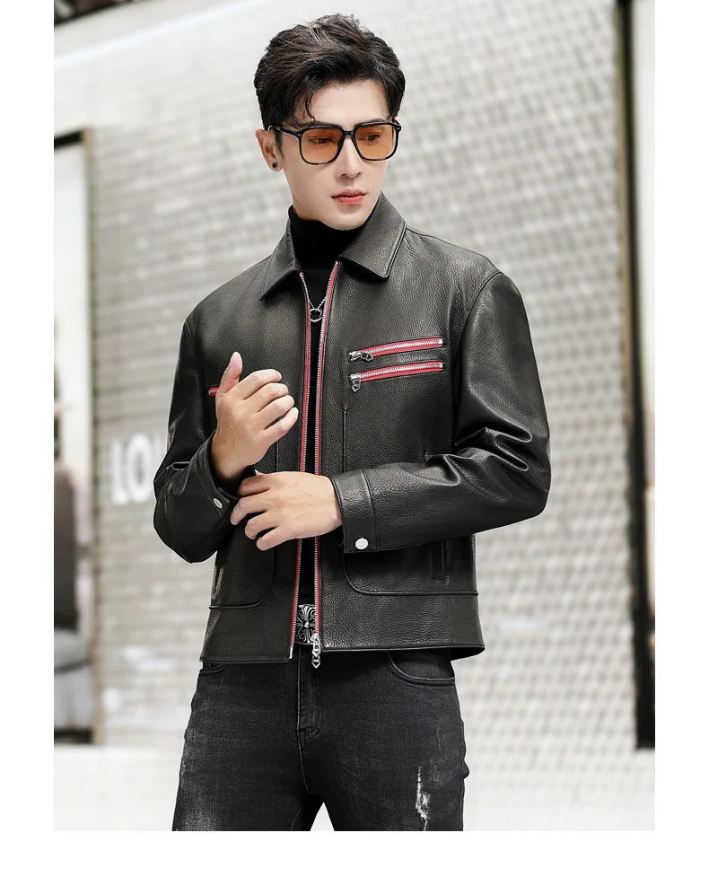 Model in a black leather jacket with Carmine Pink details, touching the cuff with one hand — From Borcelleclothes.