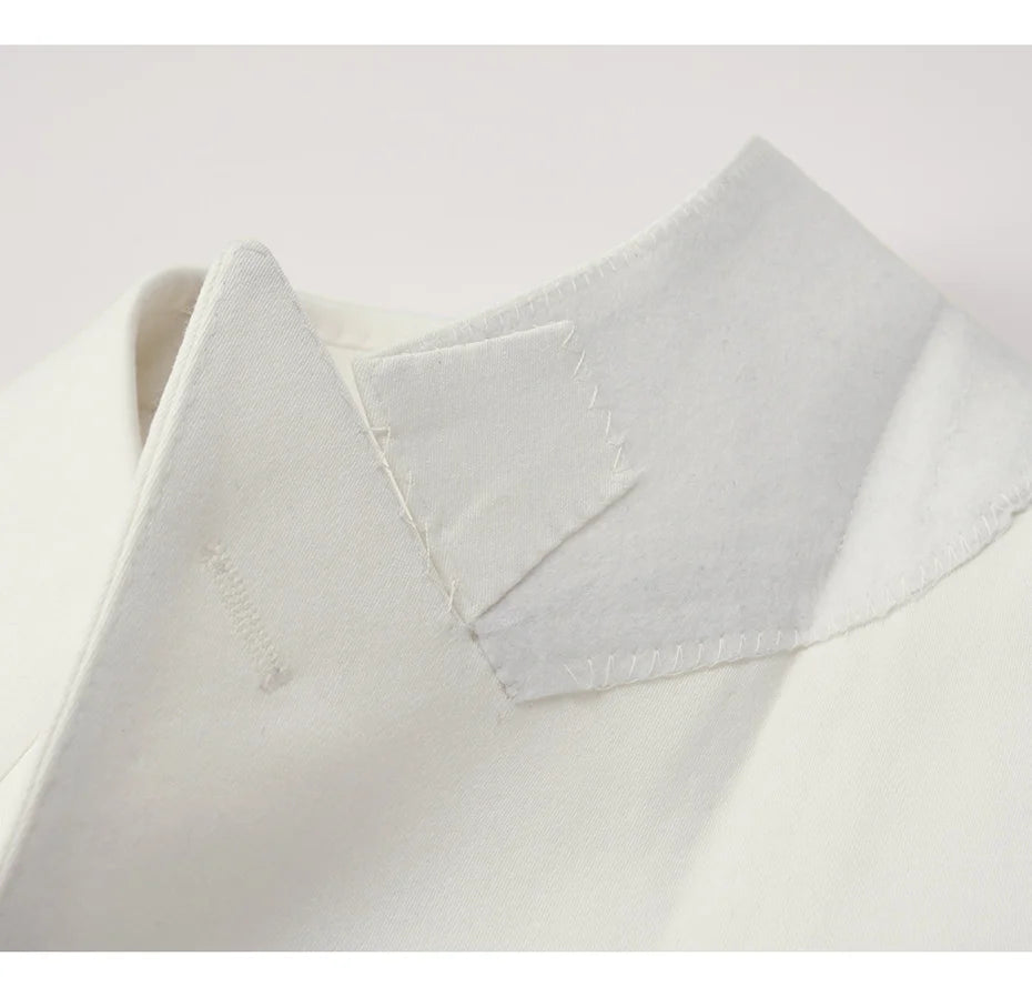 The Men's Luxury Alabaster Suit's blazer felt undercollar, showcasing impecable craftsmanship. From Borcelleclothes.