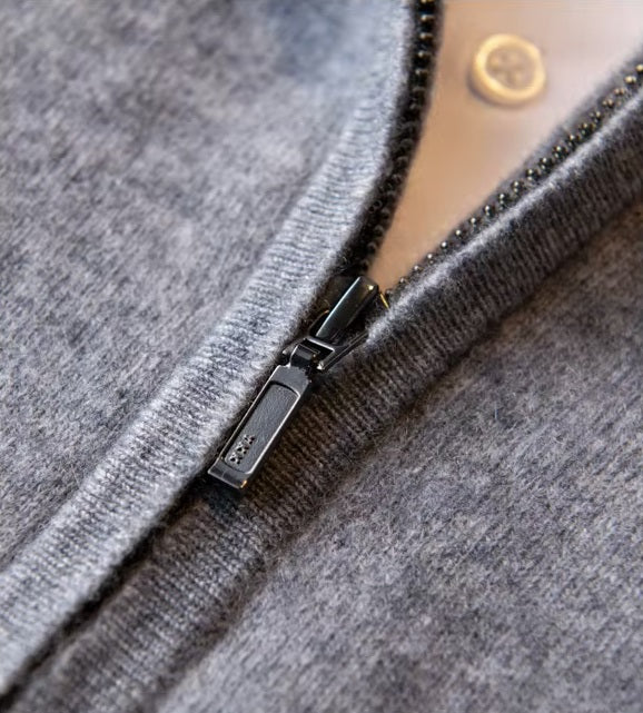 The concealed zipper closure on the Men's Luxury Albas Cashmere Cardigan in Oslo Grey, emphasizing its sleek and contemporary look. From Borcelleclothes.