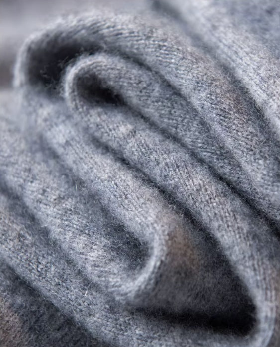 Serpentine-folded texture of the Men's Luxury Albas Cashmere Cardigan in Oslo Grey, showcasing its premium cashmere softness and elegant drape. From Borcelleclothes.