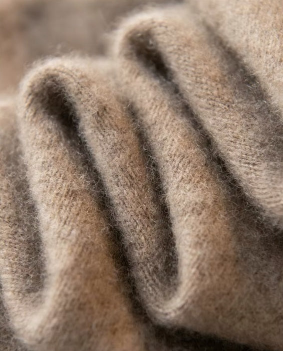 Serpentine-folded texture of the Men's Luxury Albas Cashmere Cardigan in Roman Coffee, showcasing the premium softness and flowing elegance of its fabric. From Borcelleclothes.