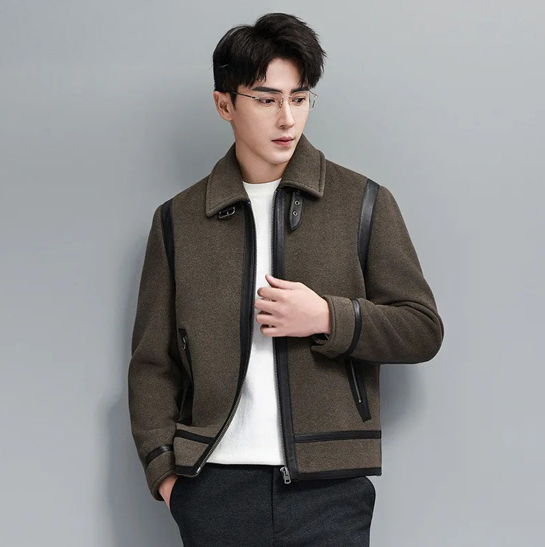 Model in Makara luxury wool-cashmere bomber with sheepskin leather trim, touching front side, from Borcelleclothes.