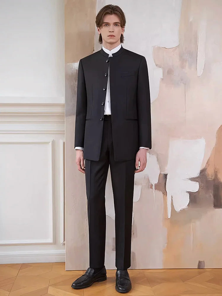 Model wearing the Borcelleclothes Men's Mandarin Collar Wool Ensemble in Onyx, standing with straight arms to emphasize the sharp tailoring and structured silhouette.