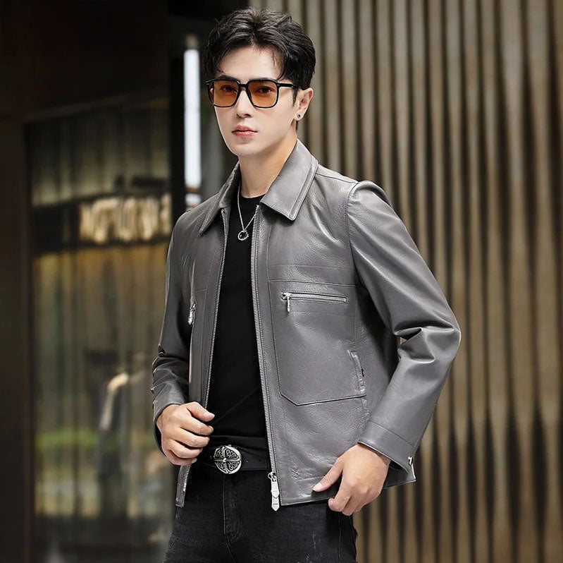 Mercury-toned sheepskin jacket shown unzipped, model holding front panel — From Borcelleclothes.