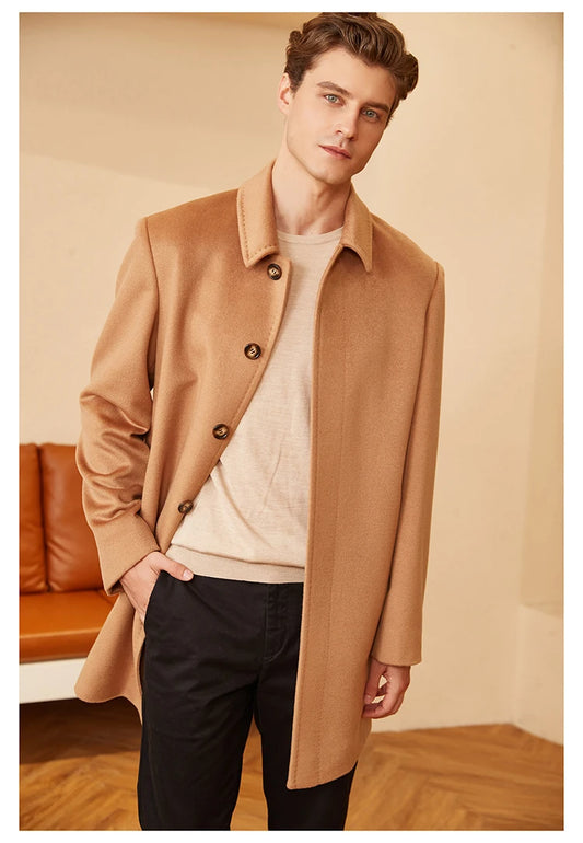 Model facing forward in the minimalist cashmere coat in Burning Sand, showcasing the clean front lines and timeless neutral tone. From Borcelleclothes.