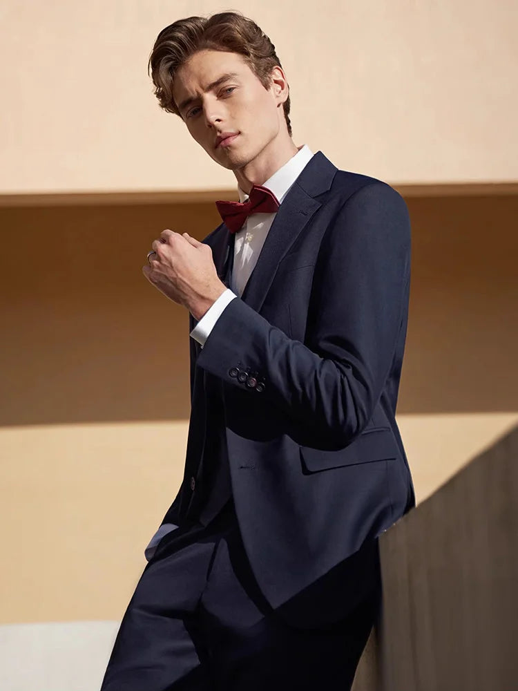 Model wearing the Borcelleclothes Men's Modern Gentleman’s Ebony Clay Suit, with one arm bent, highlighting the structured fit and elegant tailoring.