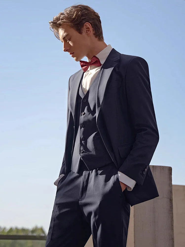 Model wearing the Borcelleclothes Men's Modern Gentleman’s Ebony Clay Suit with both hands in the pants pockets, emphasizing the relaxed yet polished fit.