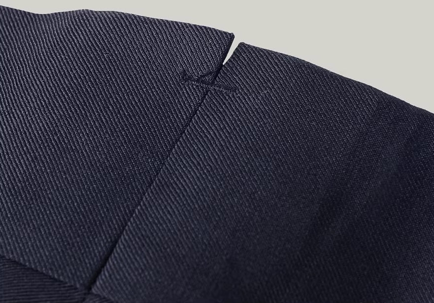 The V-split with reinforcement on the back waistband of the pants from the Borcelleclothes Men's Modern Gentleman’s Ebony Clay Suit, providing durability and comfort.