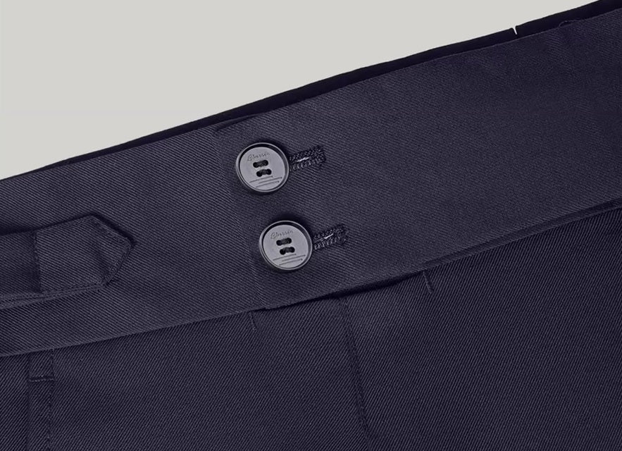 The two secure buttons on the waistband of the pants from the Borcelleclothes Men's Modern Gentleman’s Ebony Clay Suit, ensuring a comfortable and secure fit.