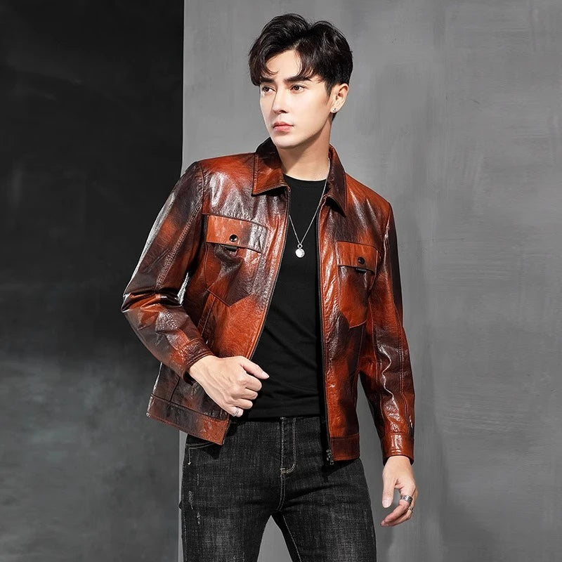 Men's Mottled cowhide leather jacket with pointed collar, chest flap pockets, snap cuffs, and hem band; quiet warmth before it’s named. From Borcelleclothes.