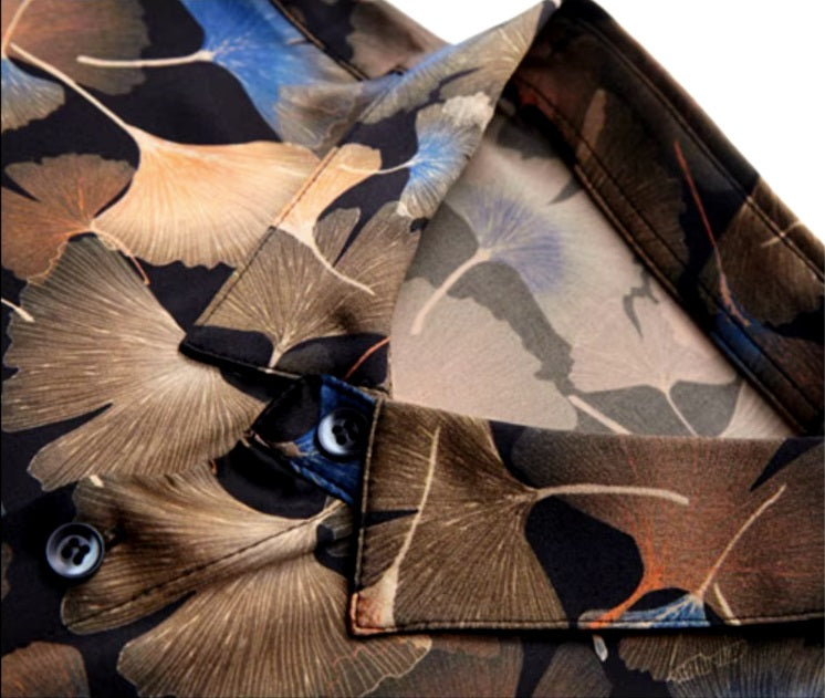 Detailed stitching and textured fabric on the collar of the Men's Nature-Inspired Mulberry Silk Shirt featuring an intricate ginkgo leaves pattern on a rich dark background, showcasing warm earthy shades and blue accents, symbolizing endurance and the beauty of changing seasons. From Borcelleclothes.