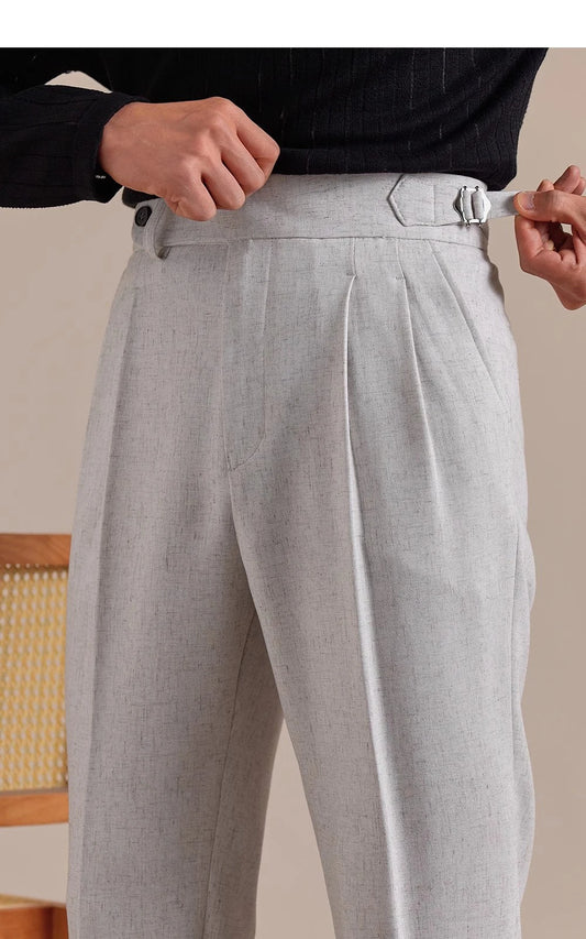 Model adjusts side tab on cropped Nobel trousers—highlighting discreet tailoring and built-in waist regulation. From Borcelleclothes.