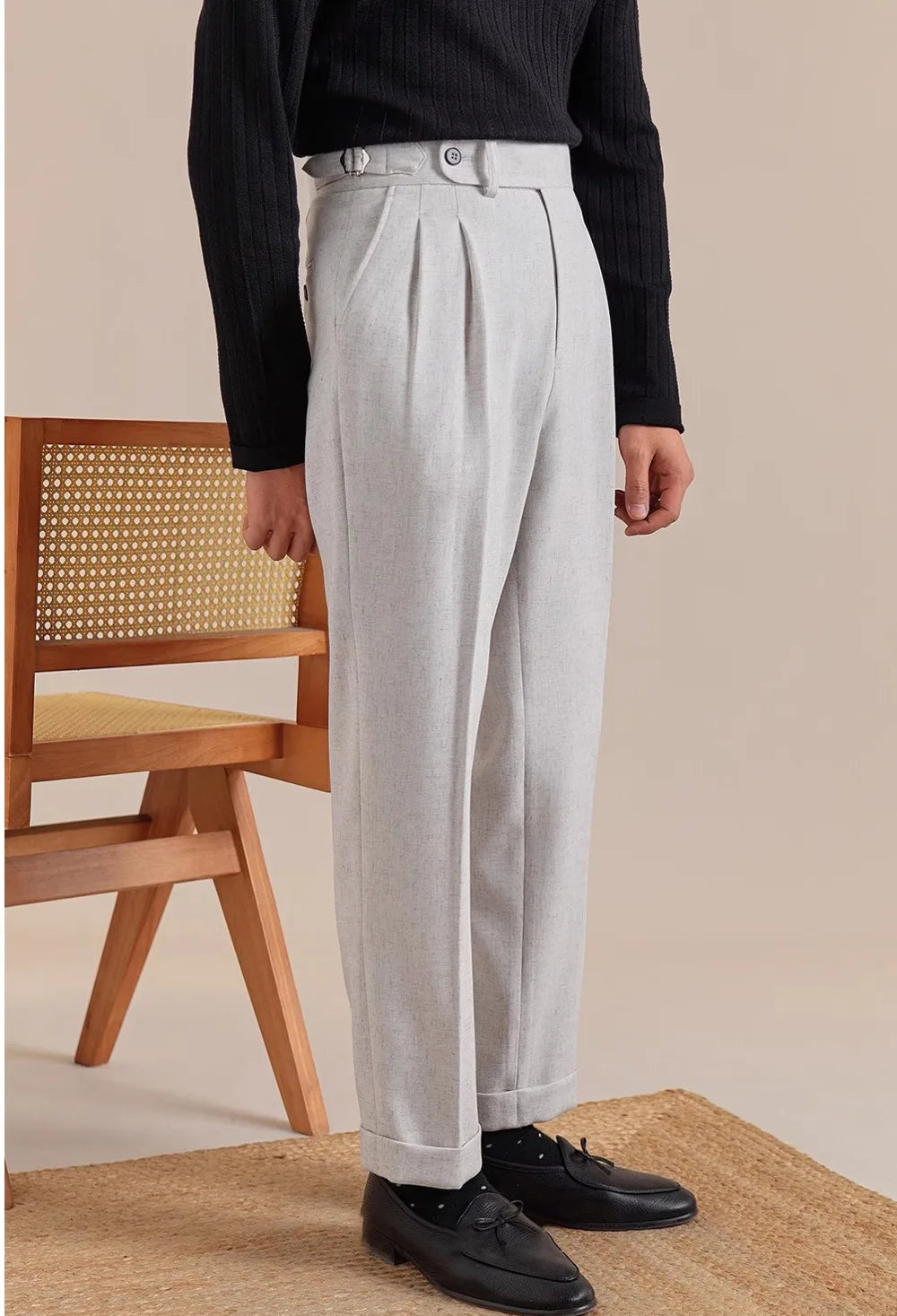 Model turns slightly in Nobel trousers—revealing side adjusters and natural drape of the cropped silhouette. From Borcelleclothes.