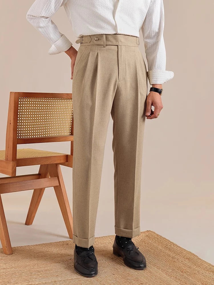 Model in Sandrift trousers with hand behind back—highlighting straight waistband and clean rear silhouette. From Borcelleclothes.