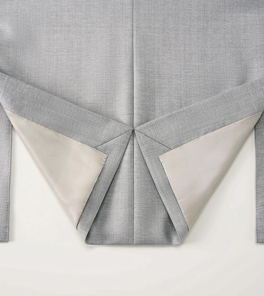 Hem of the blazer unfolded to reveal clean inner construction and meticulous finishing. From Borcelleclothes.