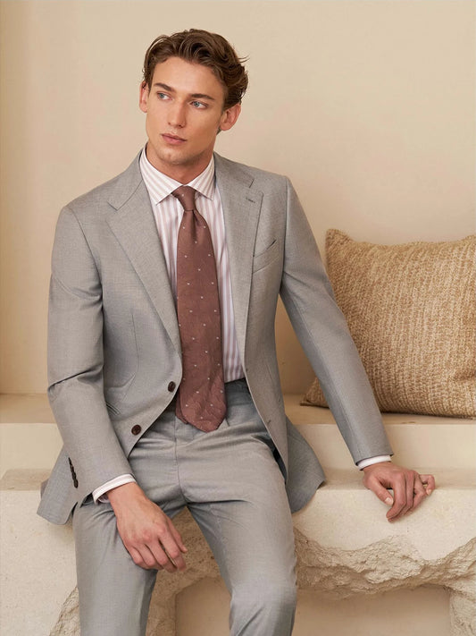 Men’s Nobel wool suit in light grey — single-breasted blazer with notch lapels and horn buttons, paired with slim trousers. From Borcelleclothes.