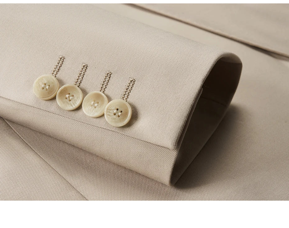 Detail of decorative buttonholes on the blazer's sleeve placket in the Ash suit. From Borcelleclothes.