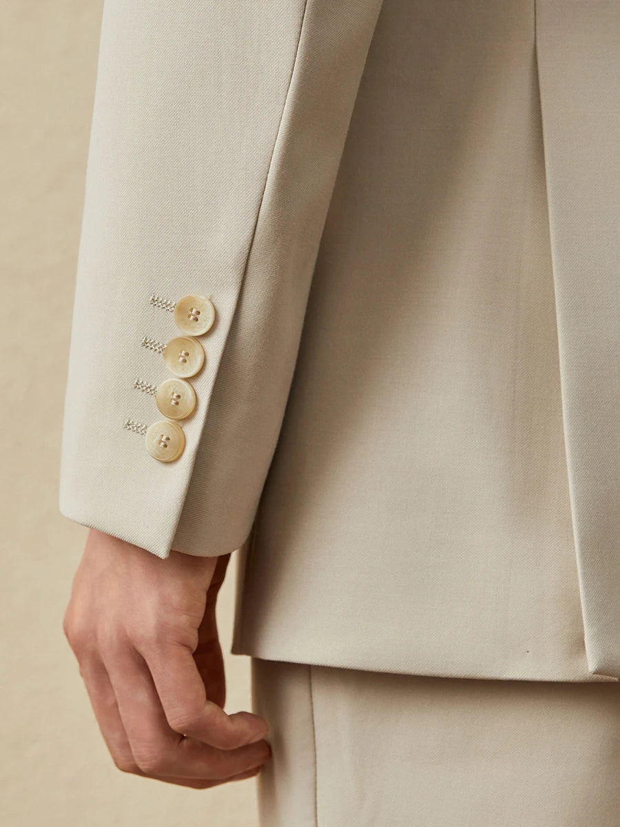 Close-up of the blazer's sleeve placket with decorative horn buttons on the Ash suit. From Borcelleclothes.