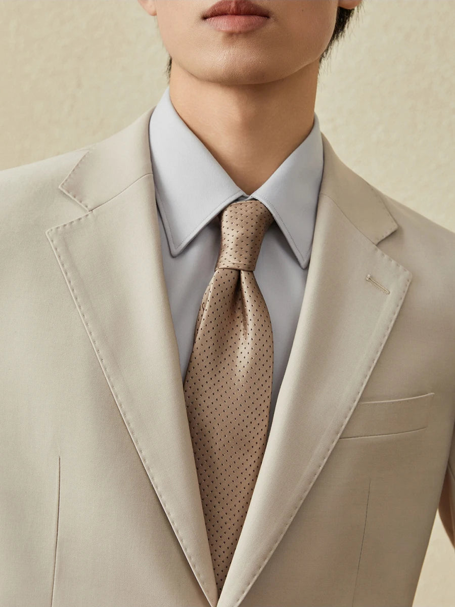 Upper part of the model wearing the Ash suit, highlighting the blazer's refined tailoring. From Borcelleclothes.