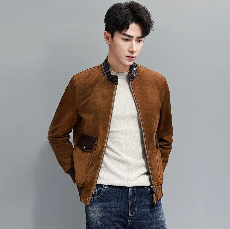 Nutmeg Suede Bomber — model with hands behind back; sheepskin suede, smooth-leather stand collar, rib cuffs and hem. From Borcelleclothes.