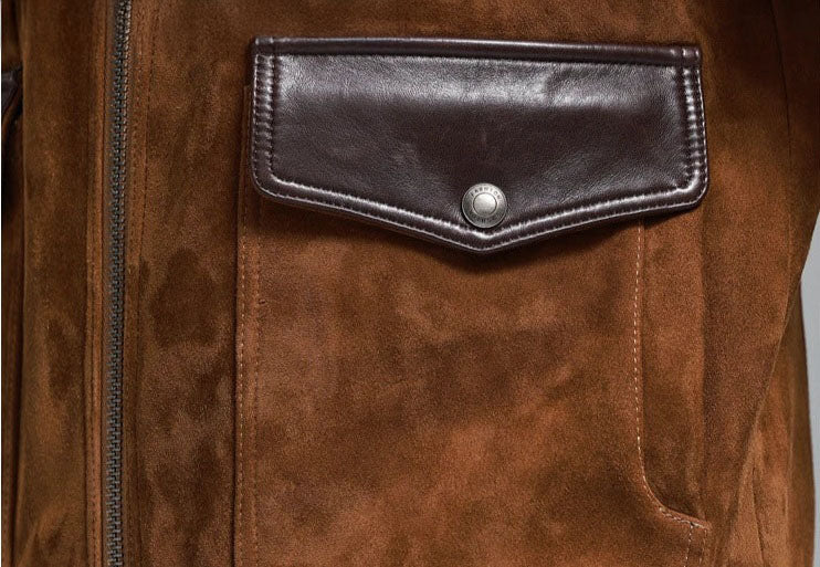 Nutmeg Suede Bomber — curved patch pocket with smooth-leather flap, snap closure; dimensional suede texture. From Borcelleclothes.