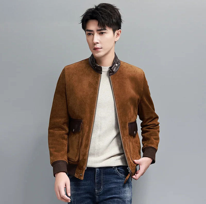 Men's Nutmeg Suede Bomber — sheepskin suede, smooth-leather stand collar, curved flap pockets, rib cuffs and hem; tactile quiet luxury. From Borcelleclothes.