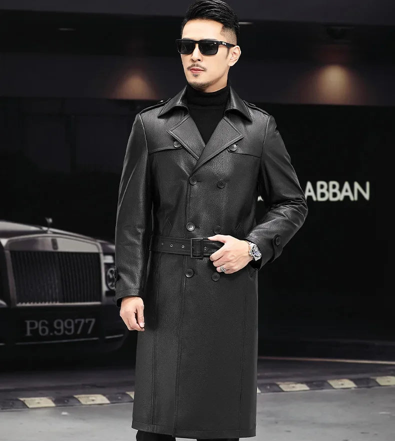 Men’s Onyx cowhide leather trench coat, model adjusting belt — From Borcelleclothes.