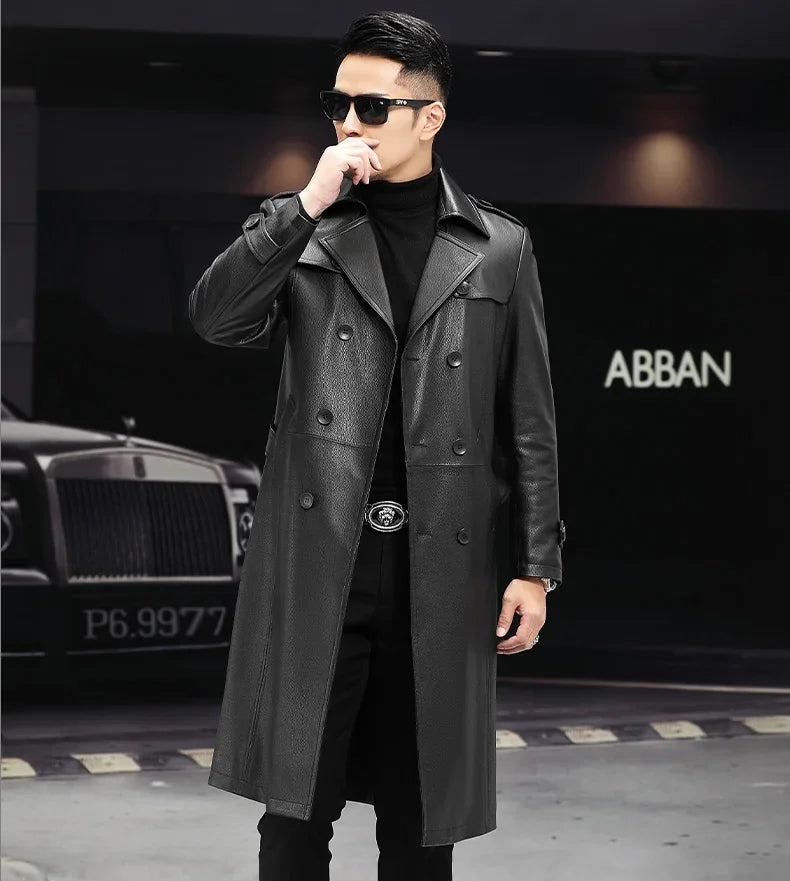 Men’s Onyx cowhide leather trench coat, model touching lips — From Borcelleclothes.