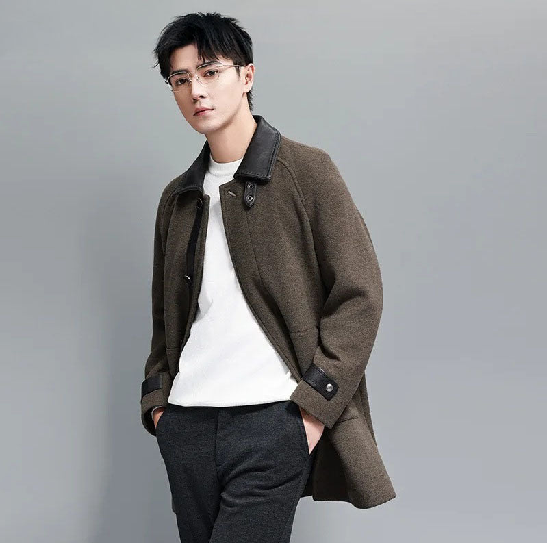 Makara color men’s coat – model with hands in pants pockets. From Borcelleclothes.