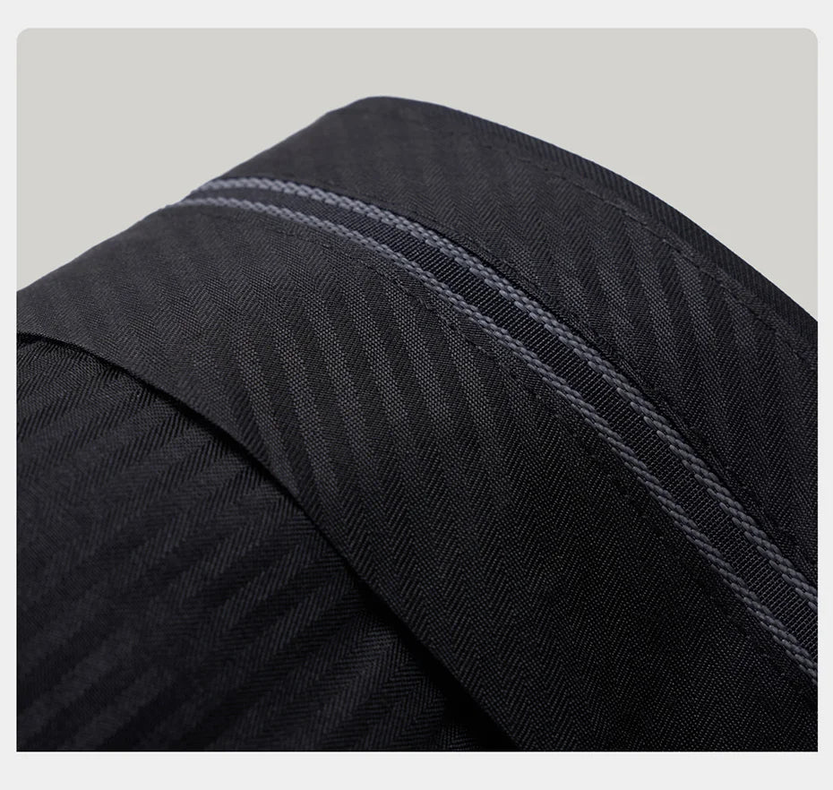 Interior waistband of the trousers featuring gripper tape to hold shirts in place. From Borcelleclothes.