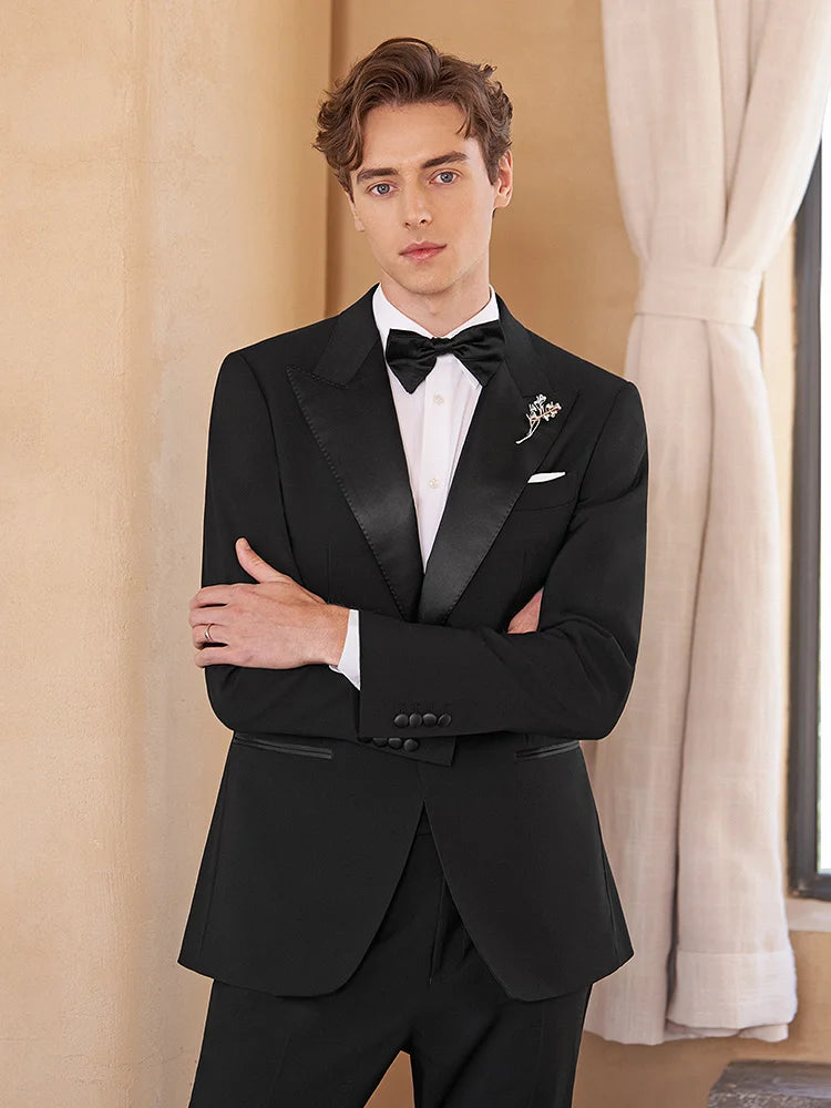 Model crossing arms in Onyx Wool Tuxedo — emphasizing confidence and presence. From Borcelleclothes.
