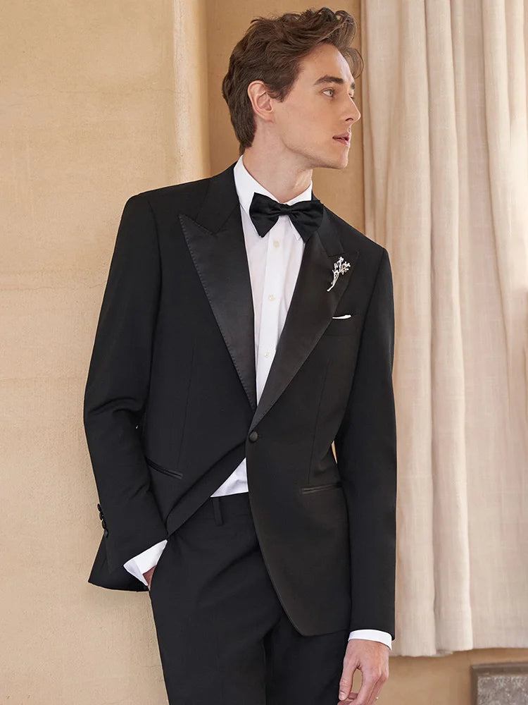 Model looking at the window in Onyx Wool Tuxedo — reflecting quiet elegance and depth. From Borcelleclothes.