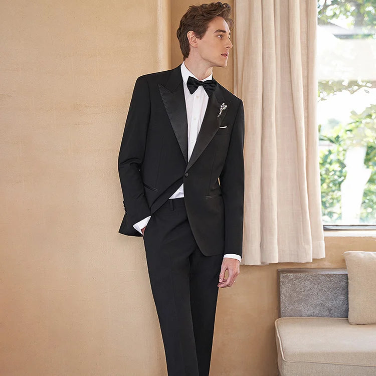 Model watching side in Onyx Wool Tuxedo. From Borcelleclothes.
