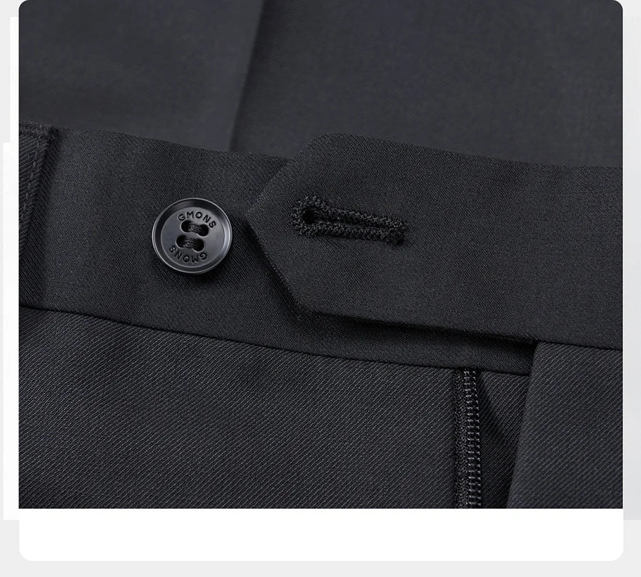 Unfastened button closure on tuxedo pants with visible horn button. From Borcelleclothes.