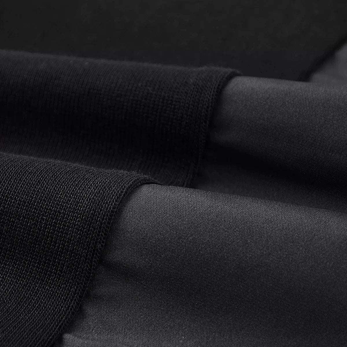 Contrasting textures and curved paneling detail on the Onyx men's patchwork sweatshirt. From Borcelleclothes.