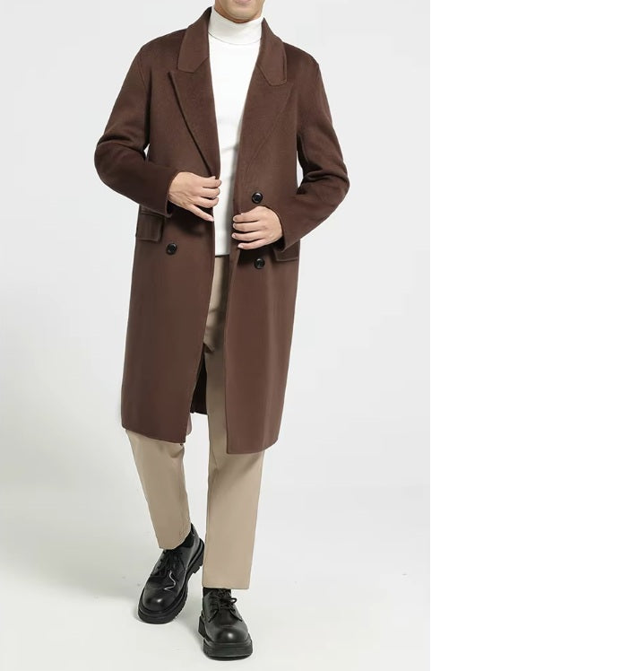A model wearing the Men's Peaked-Lapel Wool Coat in Spice, unbuttoned and touching the front sides. From Borcelleclothes.