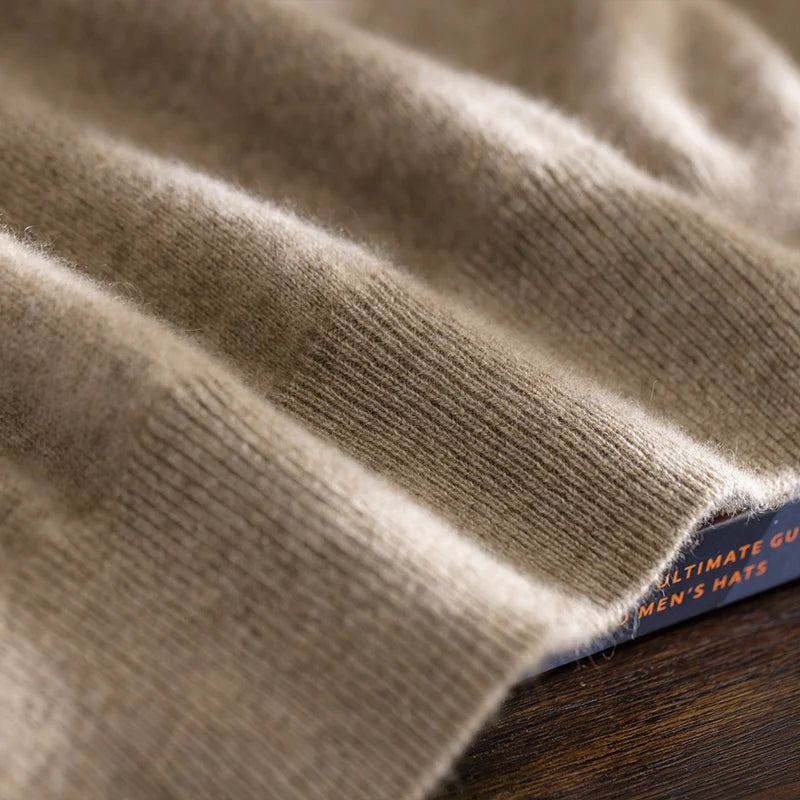 Bottom hem of the men’s plain stitch cashmere sweater in Sandrift, finished with a clean ribbed edge for subtle structure — From Borcelleclothes.