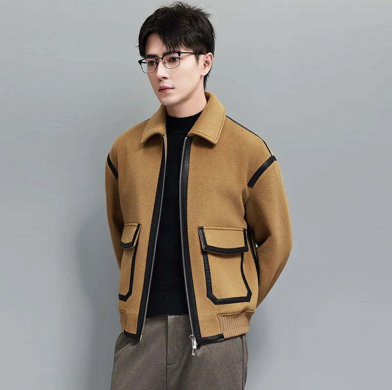 Wool-and-cashmere jacket in Lion with leather trims, model standing with hands behind back — From Borcelleclothes.