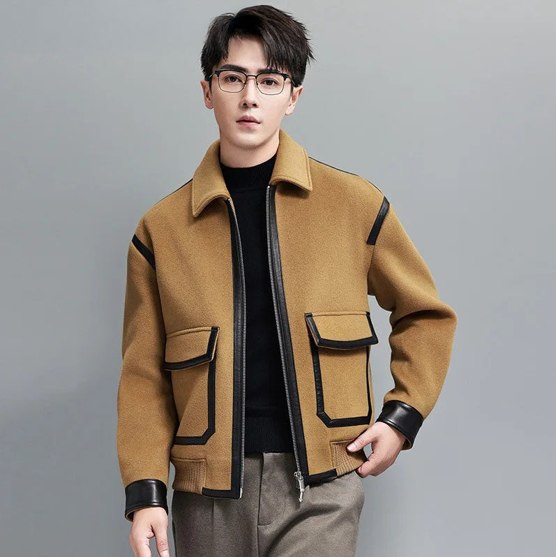 Wool-and-cashmere jacket in Lion with leather trims, model touching ribbed hem — From Borcelleclothes.