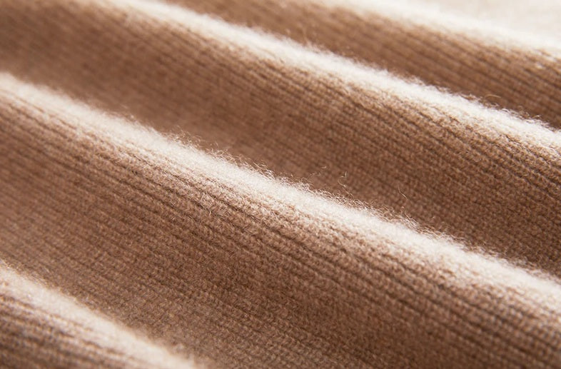 Wave-folded view of the fisherman rib texture in French Beige cashmere — From Borcelleclothes.