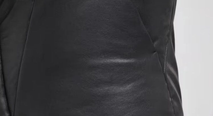 Close-up of discreet seam-integrated pocket along the angled panel of Onyx sheepskin jacket. From Borcelleclothes.