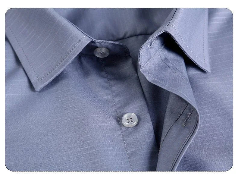 Detailed stitching and textured fabric on the collar of the Men’s long sleeve silk shirt in Blue Haze featuring a refined haze pattern with subtle feather accents for an elegant and timeless look. From Borcelleclothes.