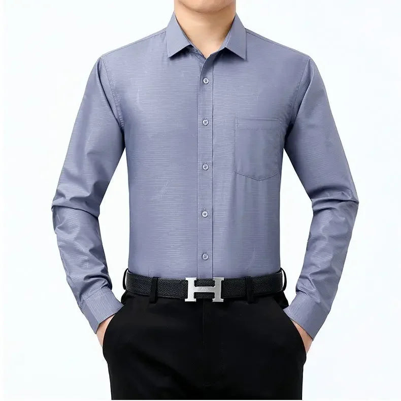 The front of the Men’s long sleeve silk shirt in Blue Haze featuring a refined haze pattern with subtle feather accents for an elegant and timeless look. From Borcelleclothes.