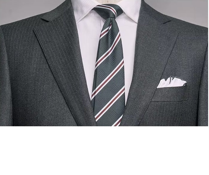 The upper part of the blazer from the Borcelleclothes Men's Steel Grey Pinstriped Suit, focusing on the notch lapels and subtle pinstripe detailing.