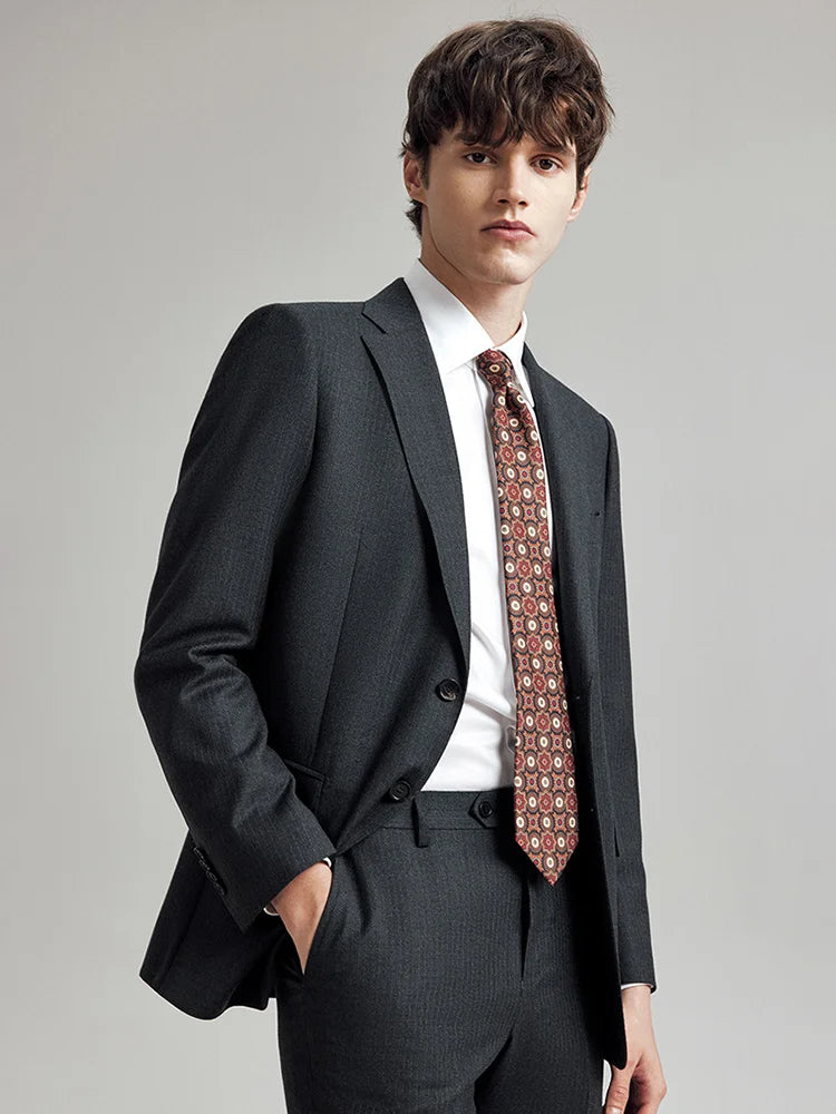 Model wearing the Borcelleclothes Men's Steel Grey Pinstriped Suit, turned slightly to the side, showcasing the clean lines and classic pinstripe pattern.