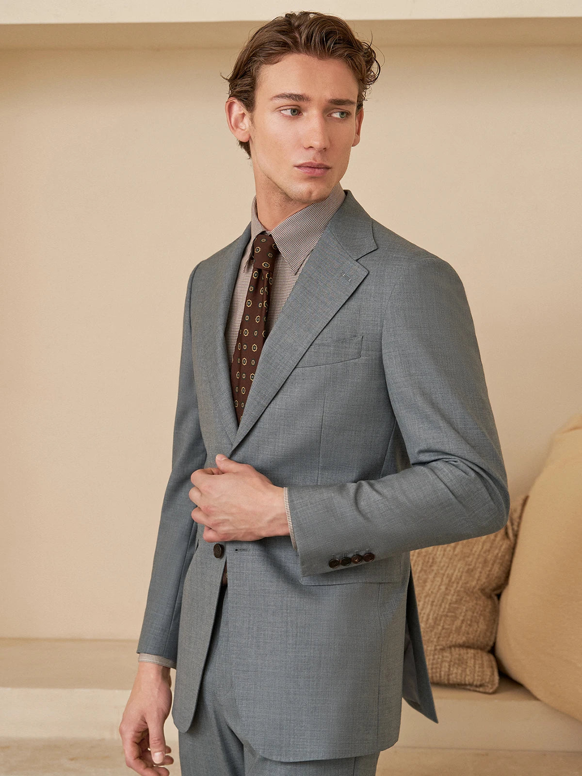 Model in the Borcelleclothes Men's Storm Grey Slim-Fit Suit, with one arm bent, showcasing the blazer's sleek fit and modern design.