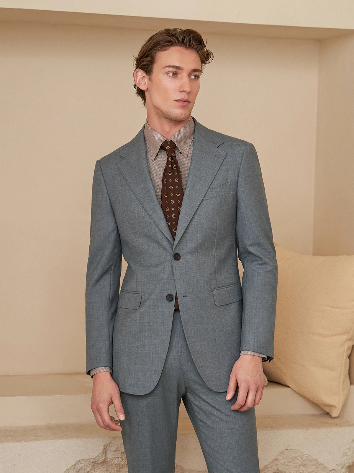 Model standing with straight arms in the Borcelleclothes Men's Storm Grey Slim-Fit Suit, highlighting the slim silhouette and clean tailoring.